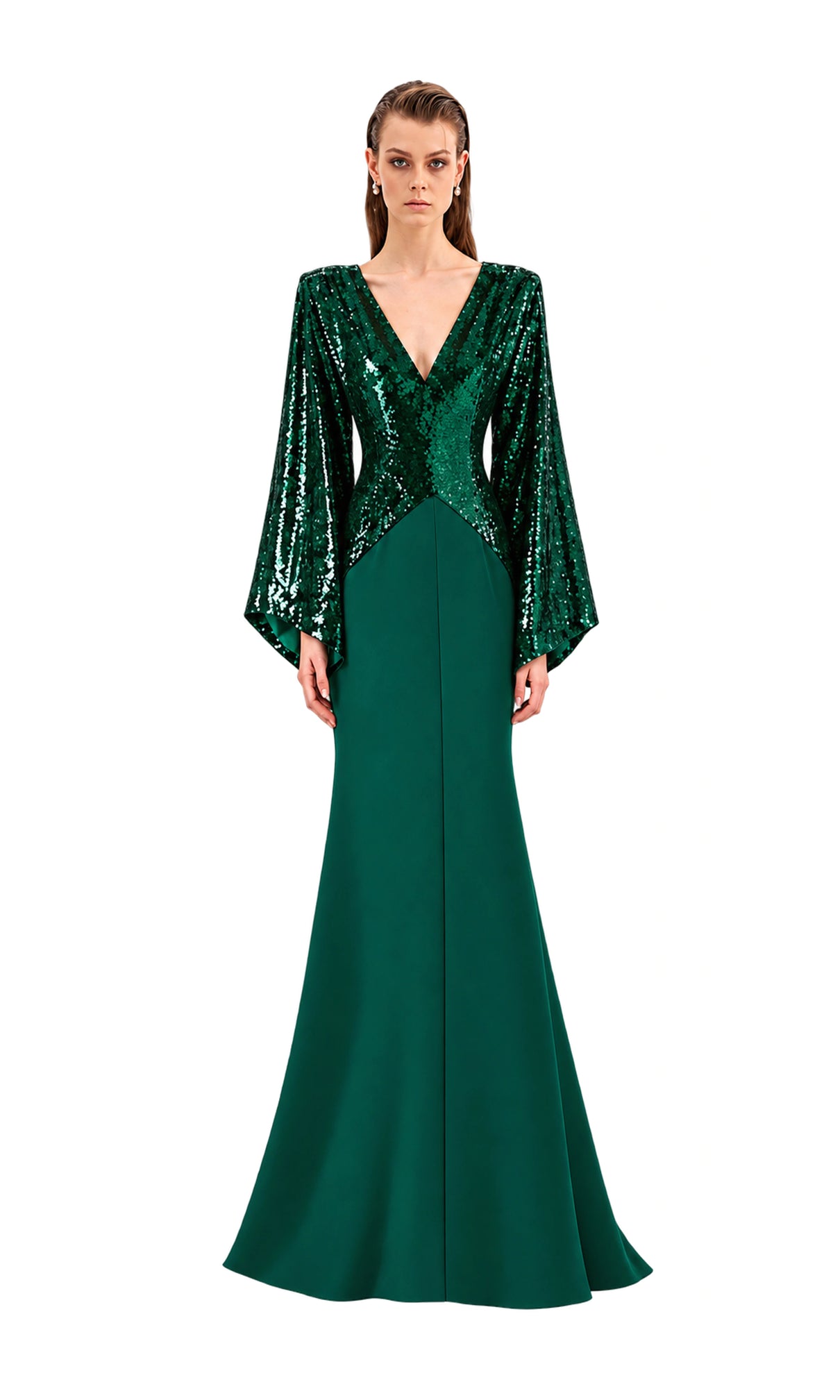 A model wearing a floor-length avaro figlio forest-green kimono maxi dress with a sequined bodice, deep V-neckline, and dramatic bell sleeves, photographed against a neutral light gray studio background.