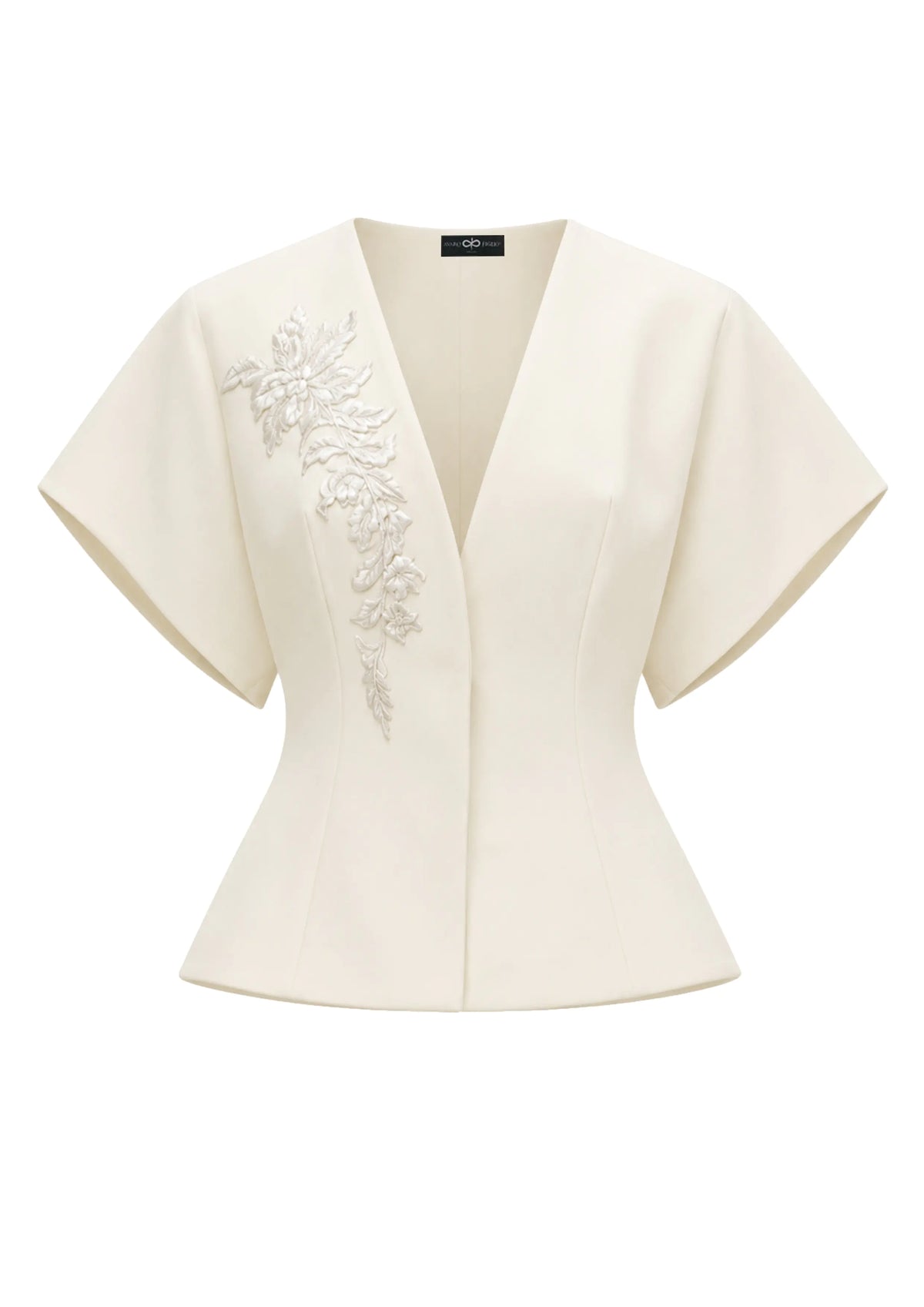 Avaro Figlio off-white short-sleeve peplum top with a V-neckline and intricate floral embroidery on the left side, displayed on a clean white background.