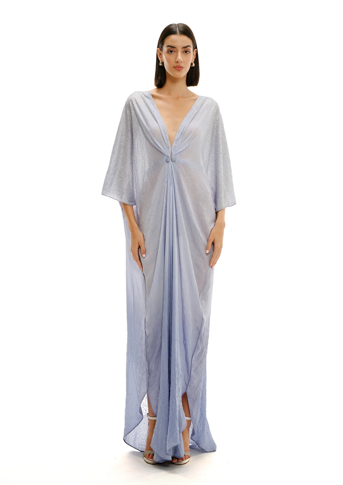 Model wearing a light blue Avaro Figlio evening Kaftan on a white background