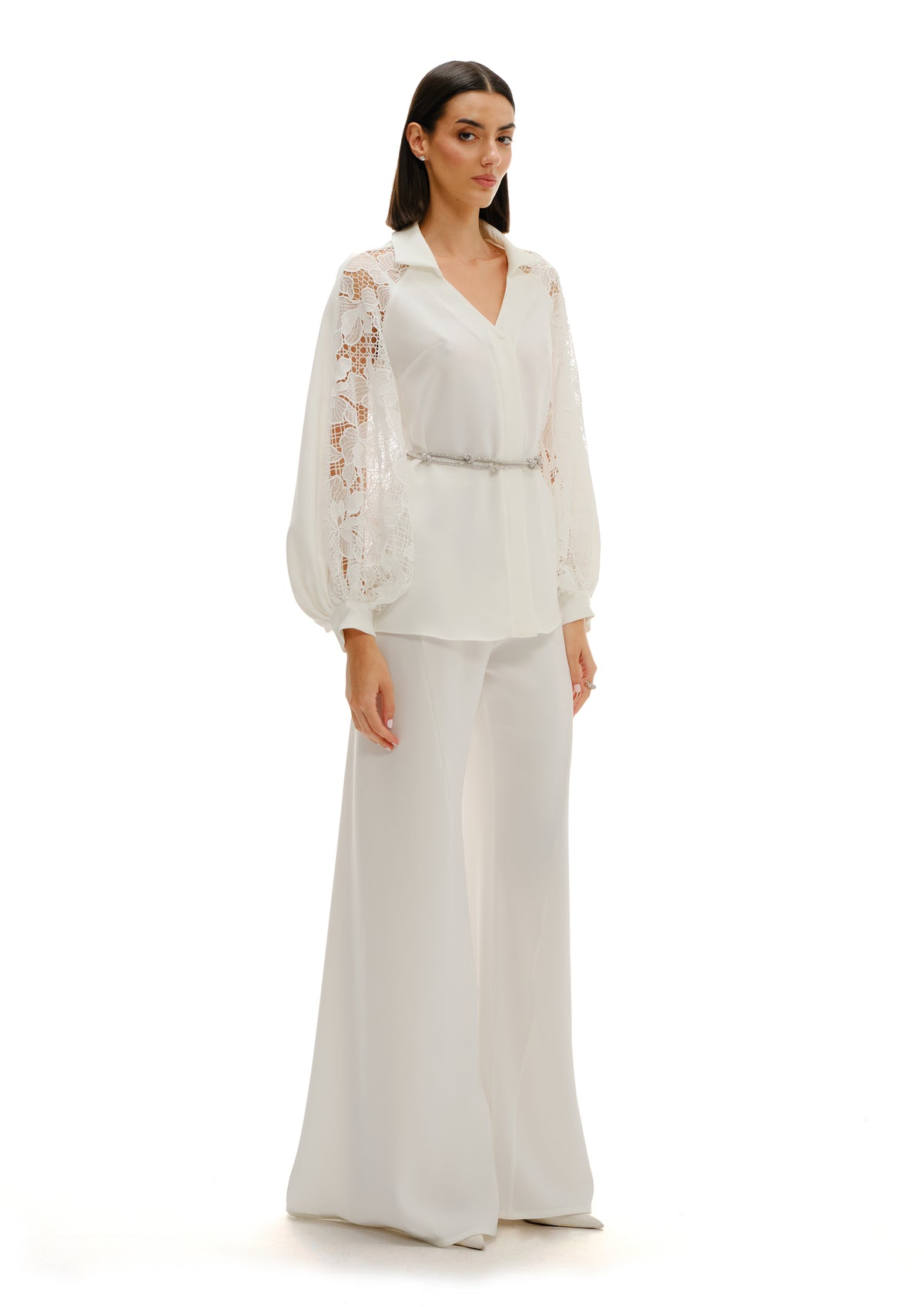 Model wearing Avaro Figlio white button-down shirt with lace inserts and Juliet sleeves