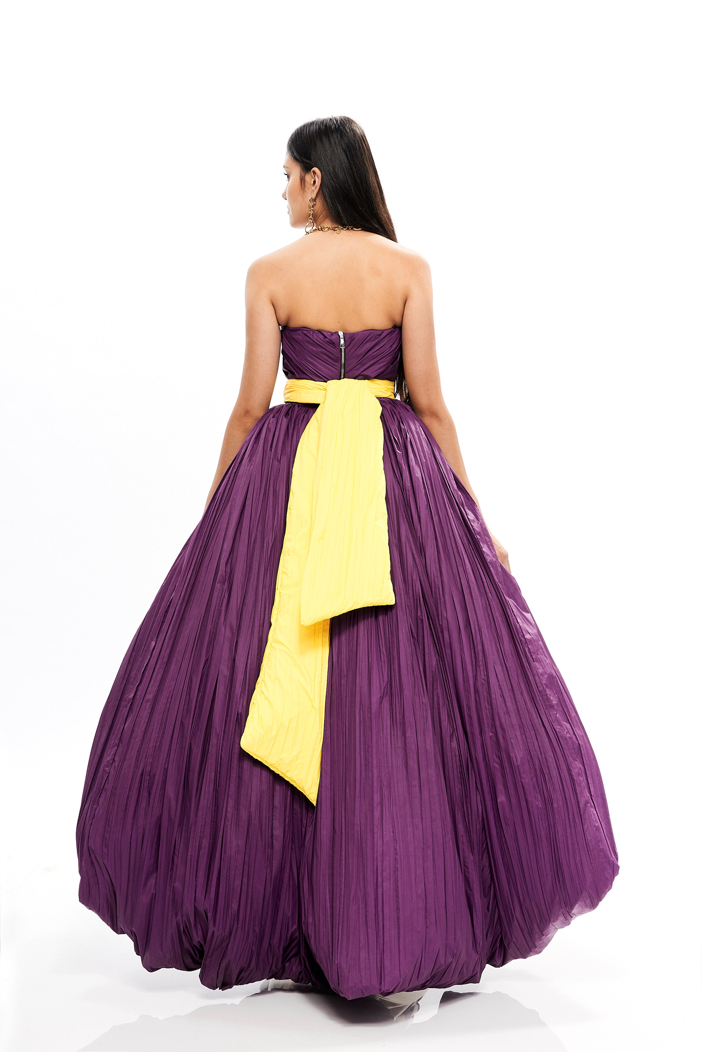 PLISSE' ASYMMETRICAL VOLUME GOWN WITH BOW