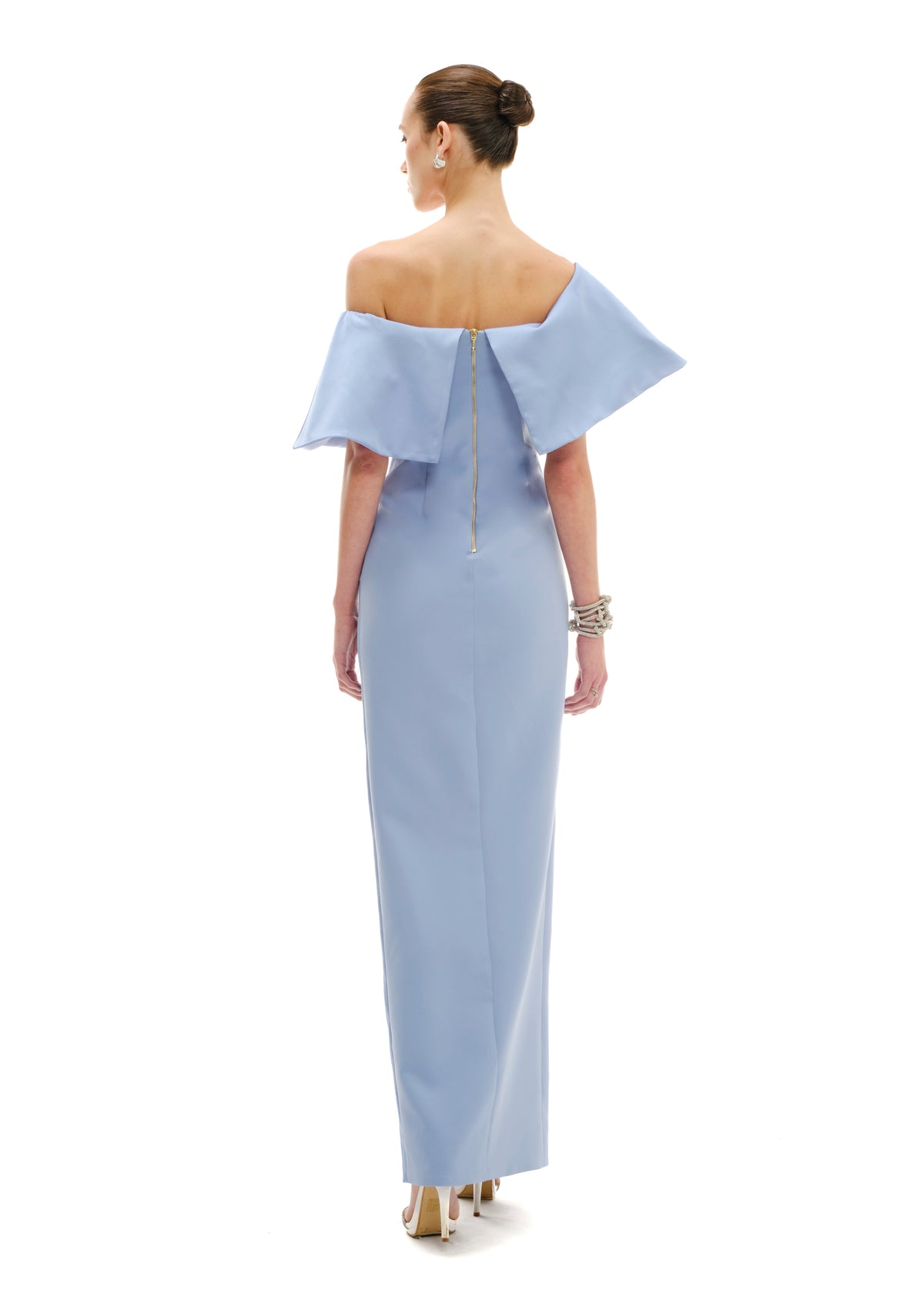 Model wearing a celestial blue  avaro-figlio off-shoulder gown on a white background
