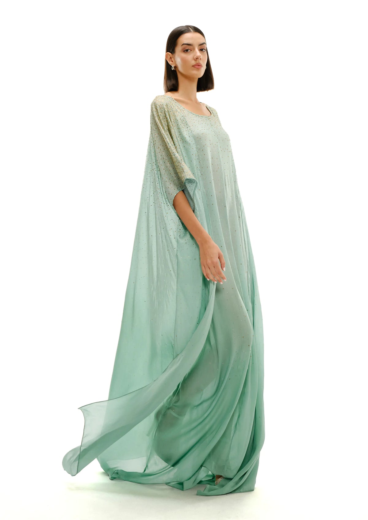Model wearing avaro figlio crystal gradient kaftan in pastel green
